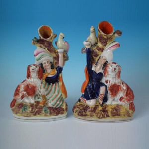 Pair Staffordshire boy & girl with spaniel & bird