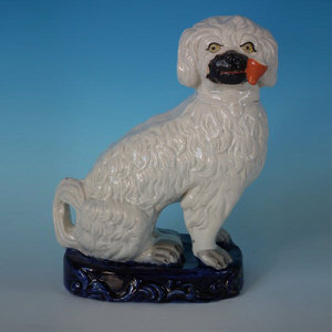 153 Staffordshire pipe smoking spaniel on blue base