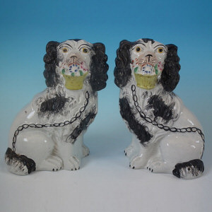 Pair Staffordshire spaniels with flower baskets
